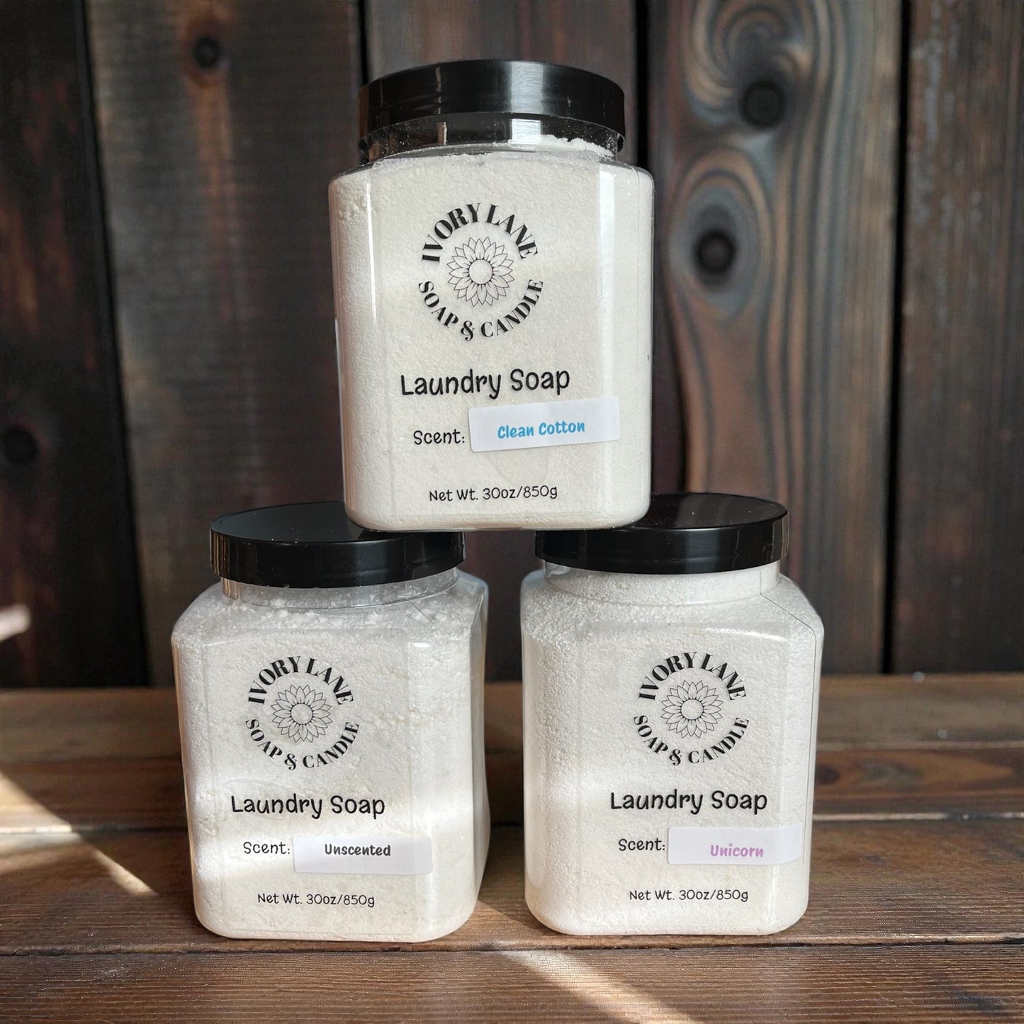 Three jars of Ivory Lane Soaps & Candle laundry soap on a wooden surface with a wooden background.