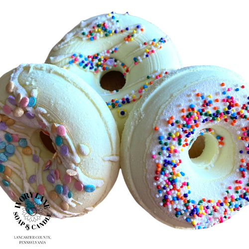 yellow donut bath bombs with white background